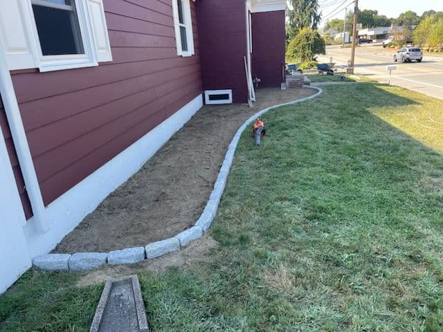 Residential Landscape Design with Cobblestone Edging
