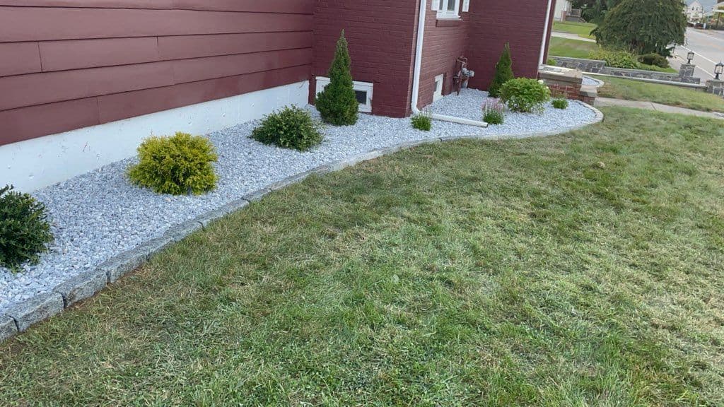 Residential Landscape Design with Cobblestone Edging